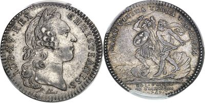a silver coin with an image of a woman on it