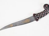 a knife that has been decorated with a pattern on it