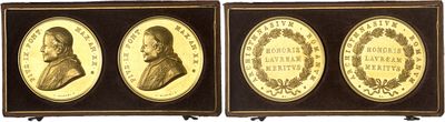 three framed portraits of men in profile with a wreath around them