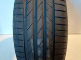 a close up of a tire on a white surface