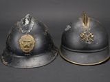 two helmets with a lion head on each of them on a gray surface
