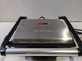a close up of a toaster on a counter with a white background
