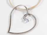 sterling silver heart pendant with blue topaz stone