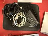 a laptop, a keyboard, a mouse, and other electronics laid out on a table