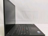a black laptop computer sitting on a white surface
