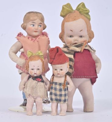 three dolls that are standing next to each other