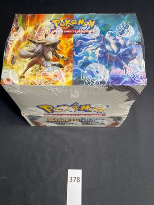 a close up of a box of pokemon cards on a table