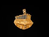 an image of a gold plated pendant with a building on it