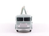 a toy truck that is sitting on a white surface