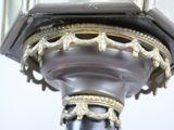 a close up of a clock on top of a pole