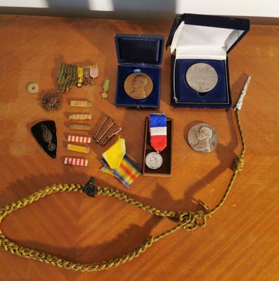 a wooden table with medals and other items on it