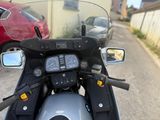 a motorcycle that is parked on the side of the road