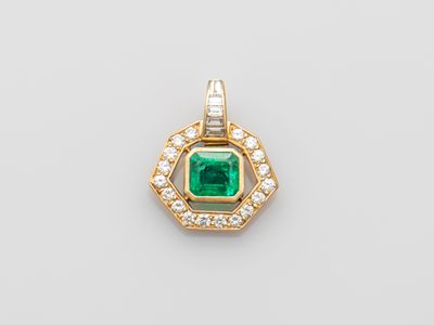 an emerald and diamond pendant