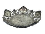 an image of a silver plate with a decorative design on it