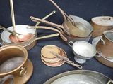 many pots and pans that are on the table