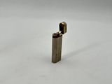 a close up of a lighter on a white surface