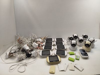 many cell phones and other electronic gadgets on the table