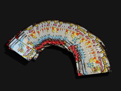 a picture of a bunch of playing cards on a black background