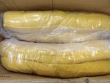 two bananas wrapped in plastic sitting in a box