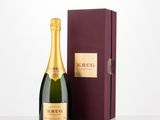 a bottle of champagne in front of a box