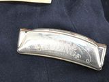 a badge on the lapel of a police officer ' s uniform