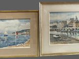 two framed pictures of boats on the water near a building