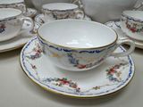a lot of cups and saucers on the table