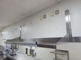 an image of a commercial kitchen with stainless steel counter tops
