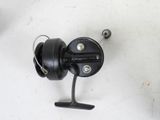 a close up of a fishing reel on a table