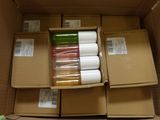 many rolls of tape in a cardboard box on the floor