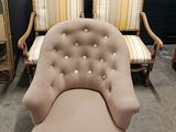 two chairs and a chair that are sitting in a room