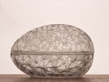 a glass bowl sitting on top of a wooden table