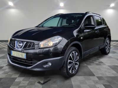 a black nissan qxv is parked in a garage