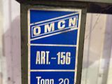 a sign on a machine that says omcn art 156 tomn 20