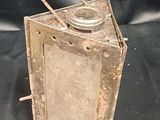a small metal object that is sitting on a black cloth