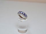 a ring that is sitting on top of a clear glass