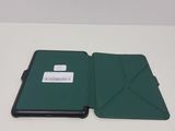 a green case that is open on a white table