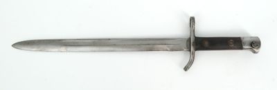 a knife that is laying on a white surface