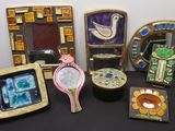 many different pieces of art that are on the table