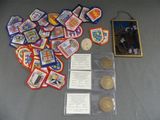 a lot of badges and coins sitting on a table
