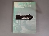 a book with a black arrow pointing to the left
