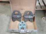 two tools in a box that are sitting on the floor