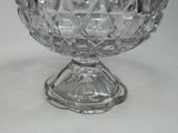 a glass bowl that is sitting on a table