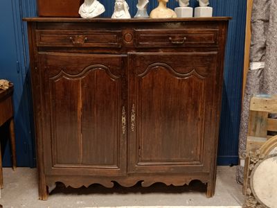 a wooden cabinet with a mirror on top of it