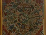 une photo d'un tableau représentant la roue de la vie, exposé dans un musée