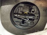 a close up of a car ' s engine with tools inside of it
