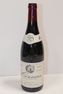a bottle of wine that is sitting on a table