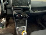 the interior of a car with a steering wheel and dashboard controls