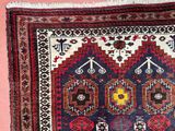 an image of a rug on a pink background with a cat sitting on the floor