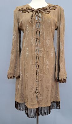 a brown dress with fringes on a mannequin mannequin